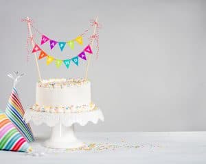 Birthday Cake with birthday party hats