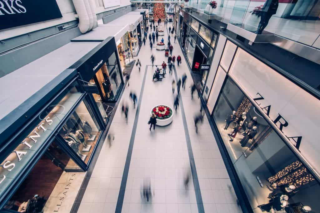 Busy mall with people walking throughi t