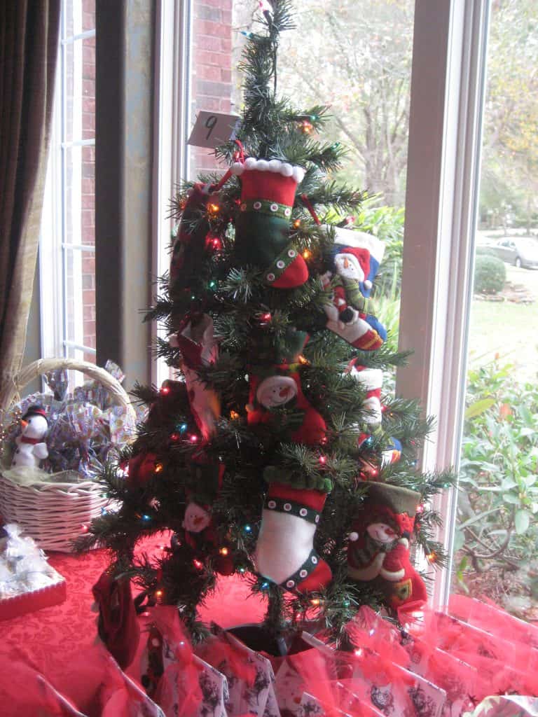 Christmas Tree with stocking ornaments filled with cookies hung on it