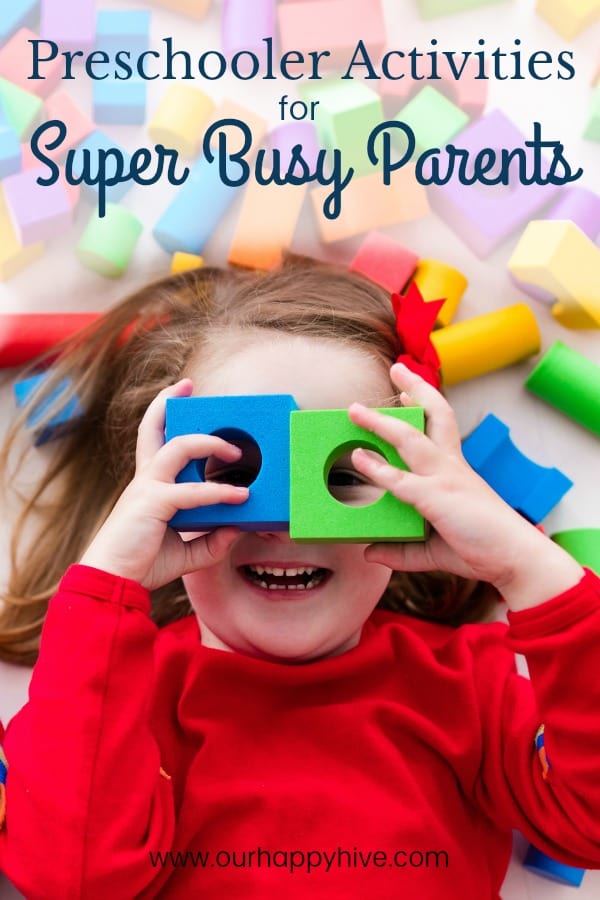 Preschooler laying down with foam blocks with circles cut out over her eyes with Text Preschooler Activities for Super Busy Parents