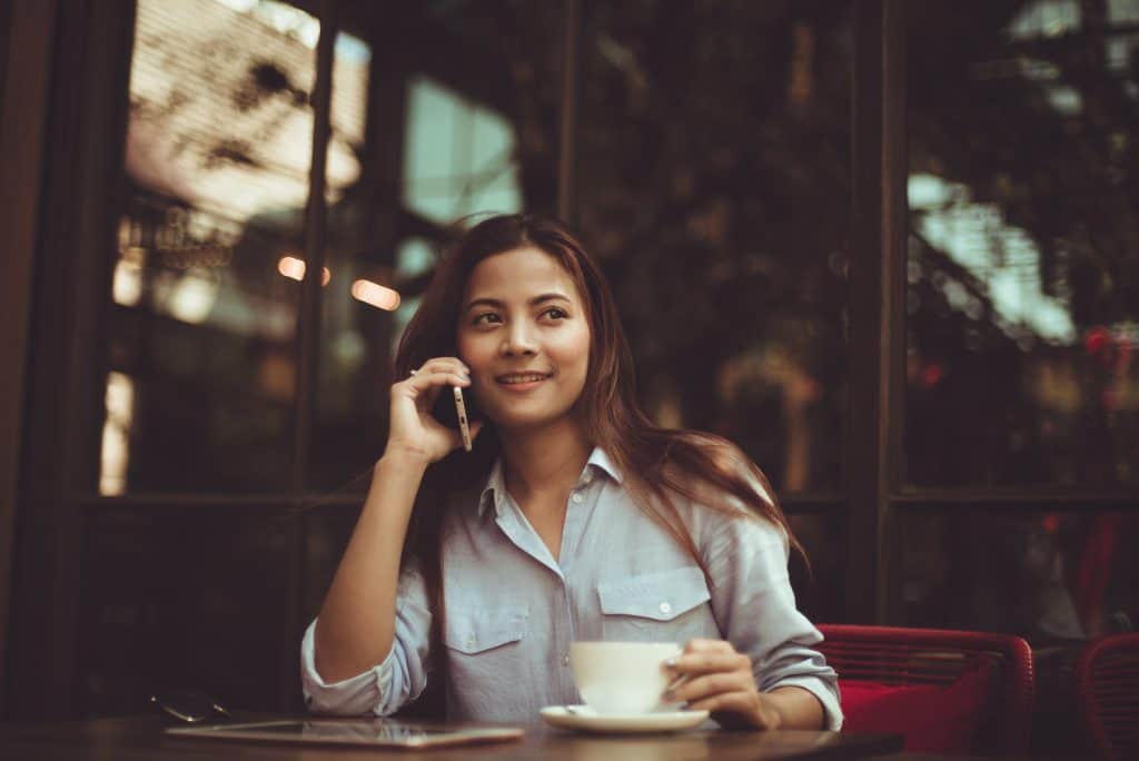 girl sitting and having coffee