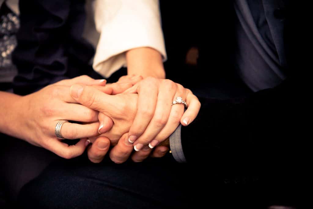 close up of a couple holding hands