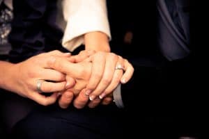 Close up of couple holding hands
