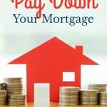 House with coins stacked beside it with text practical tips to pay down your mortgage