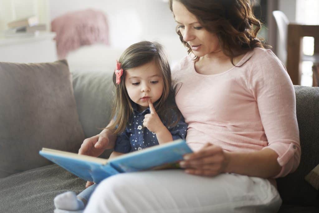 Preschooler sitting with her mom 