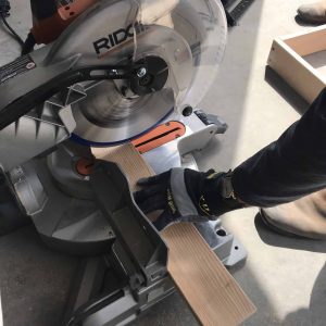 cutting wood with a saw