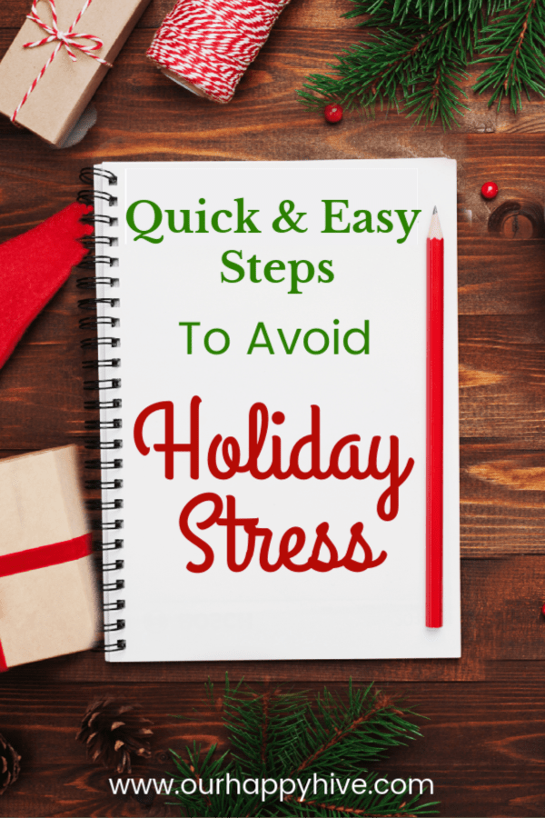 Desktop with christmas decorations and notepad that says quick and easy steps to avoid holiday stress