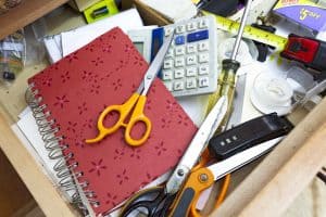 Junk drawer filled with clutter