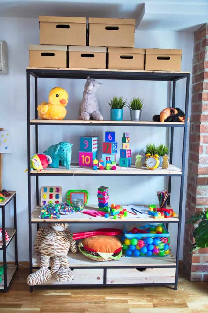 organized playroom shelves with toys and storage boxes