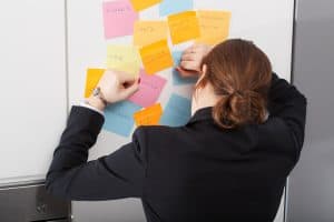 Woman is overwhelmed with to-do list of daily tasks