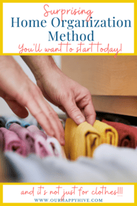 Picture of hands going through a clothing drawer of neatly folded clothes with text "surprising HOme Organization Mehtod You'll want to start today, and it's not just for clothes." www.ourhappyhive.com