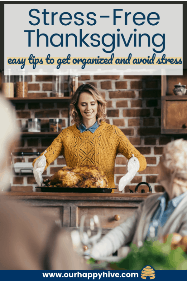 a lady getting the turkey out of the oven while family wait at the table with text stress-free thanksgiving easy tips to get organized and avoid stress