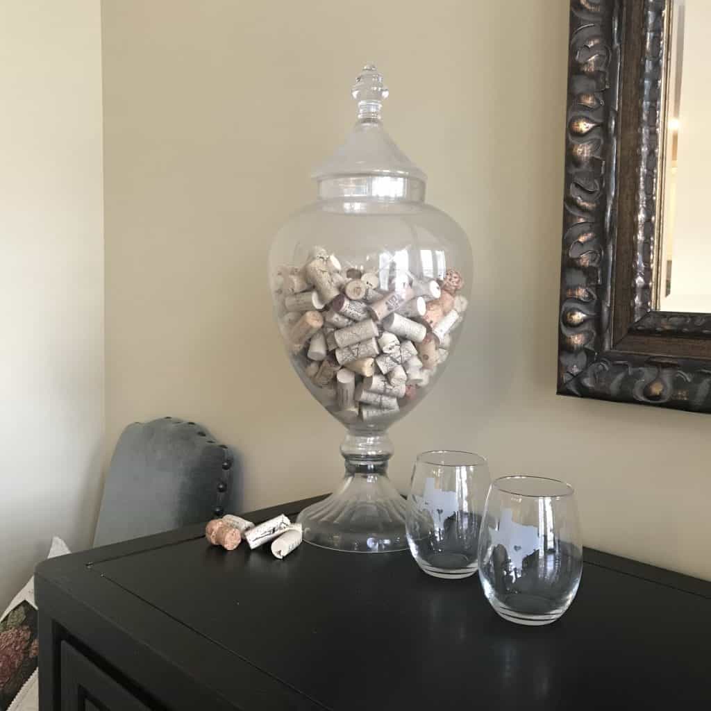 jar with wine corks stored in it.