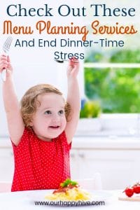 Toddler raising her hands in victory at the dinner table with text Check Out These Menu Planning Services and End Dinner-Time Stress