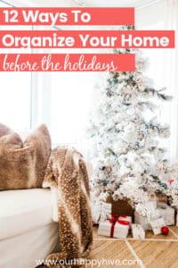 Living room with aa christmas tree and presents under the tree with text 12 ways to organize your home before the holidays.