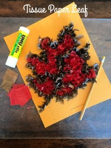 Leaf filled with brown and red tissue paper.