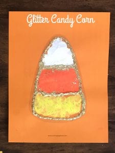 Candy Corn painted with a cork stamp and outlined in gold glitter.