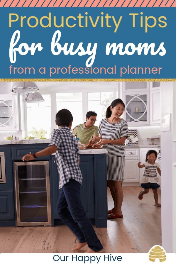 family in the kitchen with children running around the mom and text productivity tips for busy moms from a professional planner