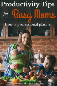 Mom with a baby and a preschooler cooking with text Productivity Tips for Busy Moms from a profssional planner