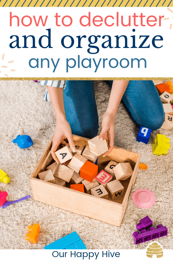 woman putting toy wooden blocks in a box with text how to declutter and organize any playroom