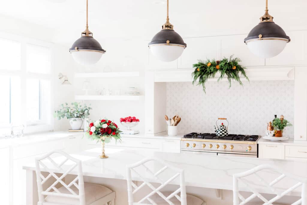 A clean and organized kitchen with a few christmas decorations.