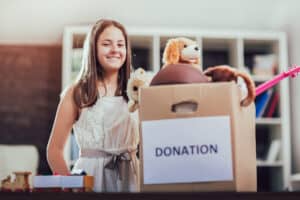 Kid finished decluttering and has a box of things to donate.